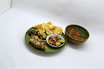 Fried Beef Oxtail with Sambal Balado. Boiled beef oxtail until tender, fried until slightly crispy and served with fresh spicy balado chili sauce.