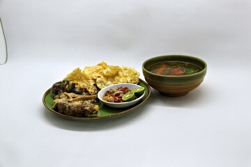 Fried Beef Oxtail with Sambal Balado. Boiled beef oxtail until tender, fried until slightly crispy and served with fresh spicy balado chili sauce.