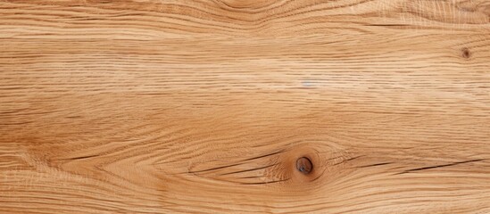 Closeup of hardwood plank with brown grain pattern and varnish