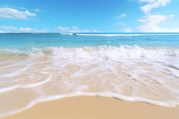 The ocean is calm and the sky is blue. The water is white and the waves are small