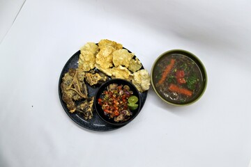 Fried Beef Oxtail with Sambal Balado. Boiled beef oxtail until tender, fried until slightly crispy and served with fresh spicy balado chili sauce.