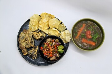 Fried Beef Oxtail with Sambal Balado. Boiled beef oxtail until tender, fried until slightly crispy and served with fresh spicy balado chili sauce.