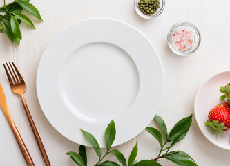 Top view of Empty white plate on white wood around with green leaves , fruit and pink salt - Powered by Adobe