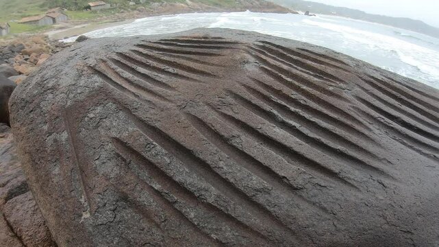 Lithic workshop, rocks used by prehistoric men to polish and produce stone tools, archaeological site in Praia do Rosa - Imbituba, Santa Catarina, Brazil