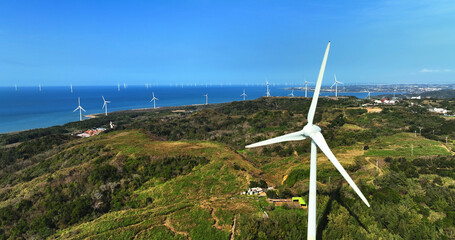 Large group of wind turbines on the mountain near by sea
