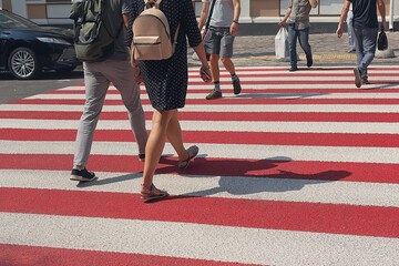 Anonymous people walking down the pedestrian lane