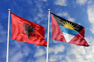 3d illustration. Albania and Antigua and Barbuda Flag waving in sky. High detailed waving flag. 3D render. Waving in sky. Flags fluttered in the cloudy sky.