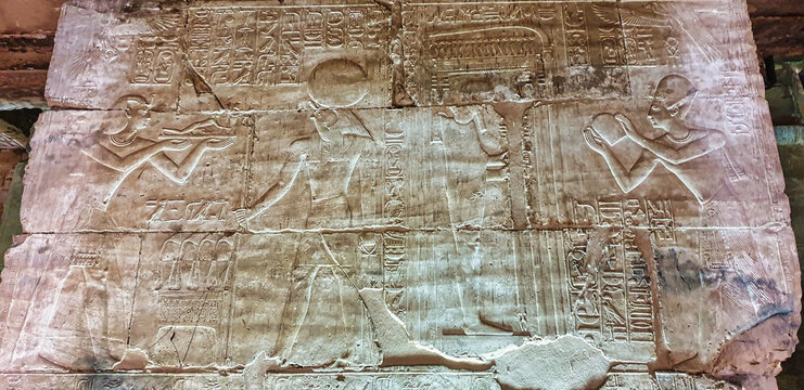 Detailed wall relief panel depicting Pharoah Seti I making offerings to God Horus  in the Temple of Seti built in 13th century BC by the Pharoah Seti I near Abydos,Egypt