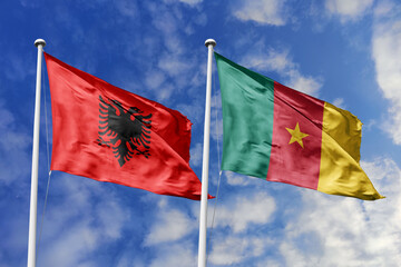 3d illustration. Albania and Cameroon Flag waving in sky. High detailed waving flag. 3D render. Waving in sky. Flags fluttered in the cloudy sky.