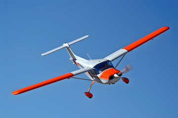 Dynamically Soaring Red and White RC Airplane Against Clear Blue Sky