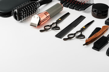 Set of barber tools for haircut on gray background flat lay