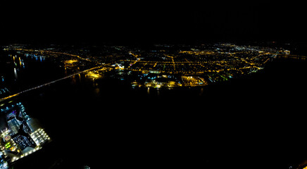 Astrakhan, Russia. Panorama of the city from the air. Night city lights. Aerial view