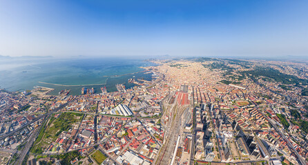 Naples, Italy. Train station - Napoli Centrale. Neapolitan Bay with ships. Panorama of the city on...