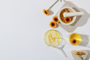 Creative background with calendula flowers for cosmetics product presentation. Blank space for...