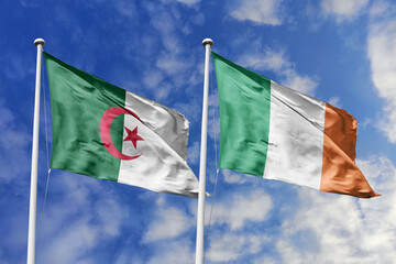 3d illustration. Algeria and  Ireland Flag waving in sky. High detailed waving flag. 3D render. Waving in sky. Flags fluttered in the cloudy sky.