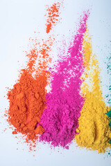 Top view of multi color holi powder isolated on white background.