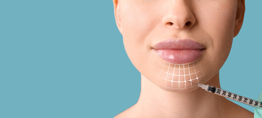 Beautiful young woman receiving filler injection in face on light blue background with space for text, closeup