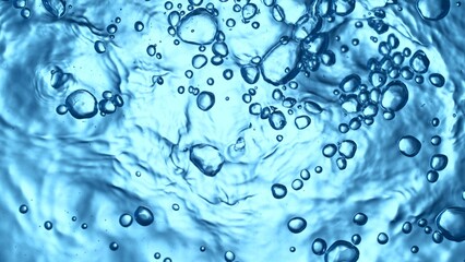 Texture of splashing water surface, top shot, bubbles