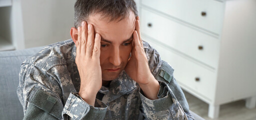 Stressed mature soldier at psychologist's office, closeup