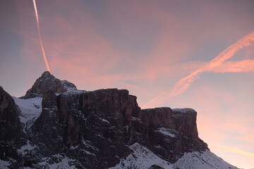 Sunset over the Mountains: Sky with Shades of Pink and Orange in Italian Dolomites Mountains Alps,...