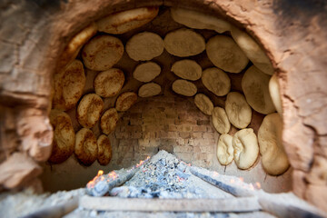 Interior view of the tandoor where traditional hot Central Asian flatbreads are baked 