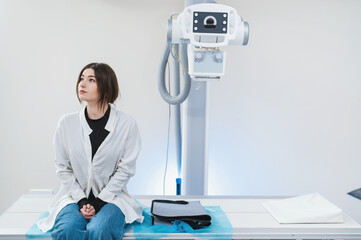 alone patient sits in x ray room waiting for results of research