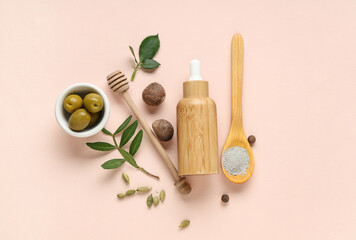 Fototapeta na wymiar Bottle of cosmetic product and cosmetic clay on beige background