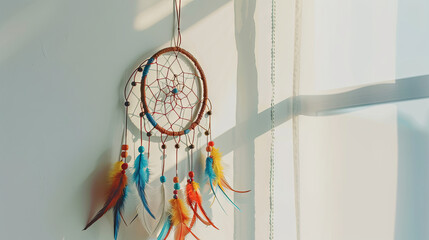 
A dream catcher gracefully suspended above the bed in the bedroom - obrazy, fototapety, plakaty