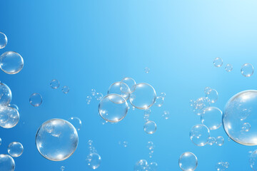 Soap bubbles on a blue background, copy space.