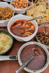 Ketupat typical Hari Raya, served with Rendang, Lodeh, and Sambal Goreng . Special dishes during Eid al-Fitr, especially in Malaysia