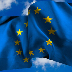  waving European Union flag against a blue sky