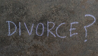 Divorce Word with Question Mark Written with Chalk on Blackboard