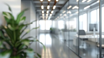 Beautiful blurred background of a modern office interior in gray tones with panoramic windows, glass partitions, and orange accents.