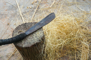 machete on a log with copy space