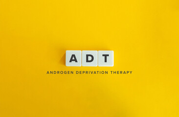 Androgen Deprivation Therapy (ADT) Banner. Acronym and Text on Block Letter Tiles on Flat Background. Minimalist Aesthetics.
