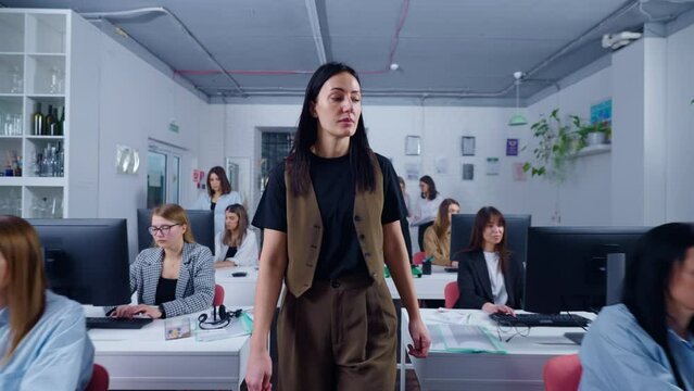 Woman Boss Walking In Office, Viewing Work Of Employees, Caucasian Lady In Casual Dress Code