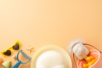 Overhead view of summer beach essentials spread out including sunglasses, sand toys, starfish, and...