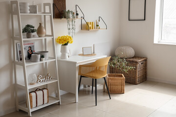 Chair and table with narcissus flowers in living room