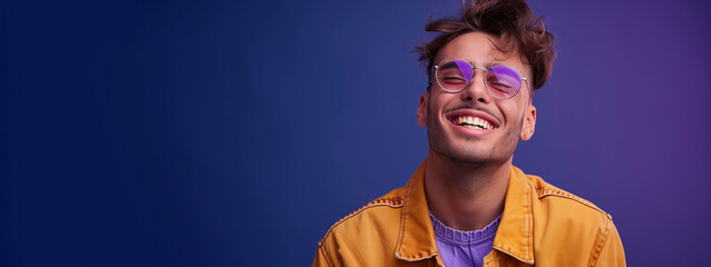 A man wearing purple and yellow clothes is smiling and wearing sunglasses. Concept of happiness and carefree attitude. generation z men, Lavanda color outfit, inspiring but also fashionable