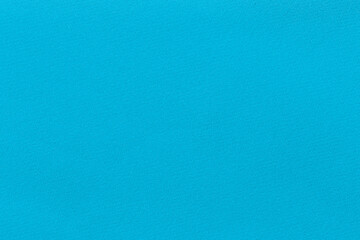 Turquoise color fabric texture as background.