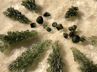 Faceted and rough Moldavite gemstones 