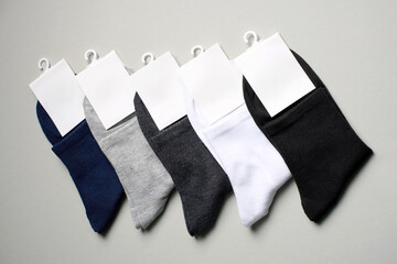 Mens new socks on a gray background, close-up. Cotton socks with blank label - 796280045