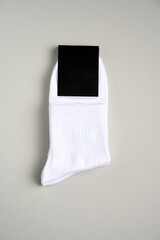 Mens new socks on a gray background, close-up. Cotton socks with blank label - 796280224