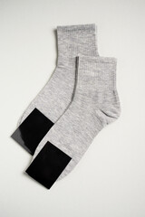 Mens new socks on a gray background, close-up. Cotton socks with blank label - 796280247