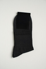 Mens new socks on a gray background, close-up. Cotton socks with blank label - 796280253