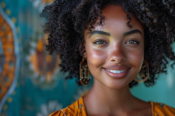 A woman with curly hair and freckles exudes joy in a bohemian-style environment with vibrant patterns in the background - obrazy, fototapety, plakaty