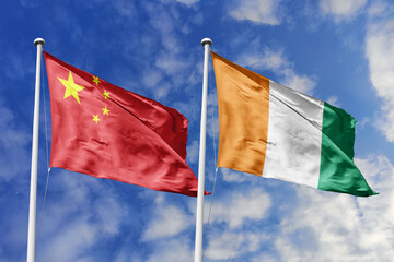 3d illustration. China and Ivory Coast Flag waving in sky. High detailed waving flag. 3D render....