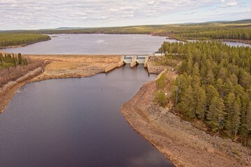 Fototapeta premium Aerial view of Porttikoski water power plant in cloudy spring weather, Sodankylä, Lapland, Finland.