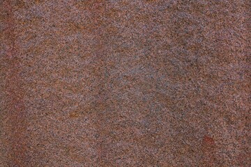Closeup of texture and uneven surface of rock.