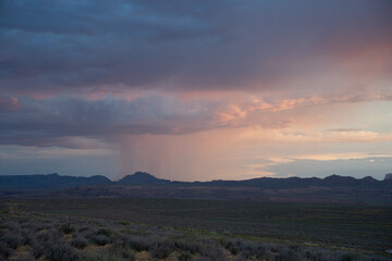 Sunset from Wahweap point in the town of Page, Arizona, with rain clouds in the background